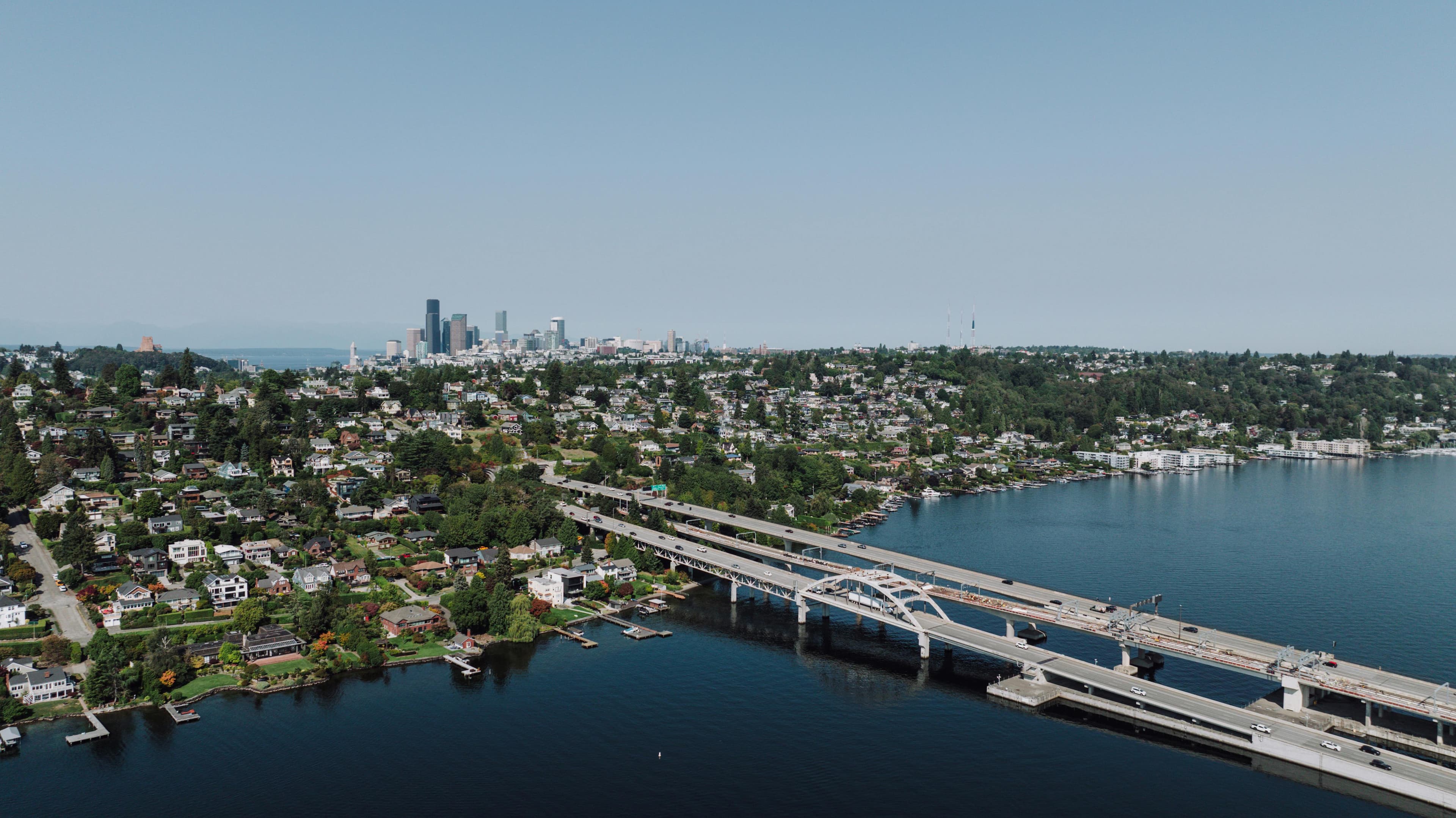 Aerial view of Mercer Island with the I-90 bridge and Seattle skyline across Lake Washington
